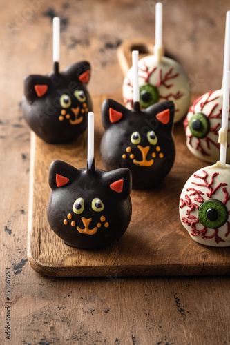 Halloween gourmet cake pops with light background. Autumn concept. Halloween holiday.
