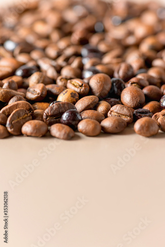 Coffee beans high quality textures background with copy space. Roasted coffee beans. A mix of different types of roasted coffee beans in the background.