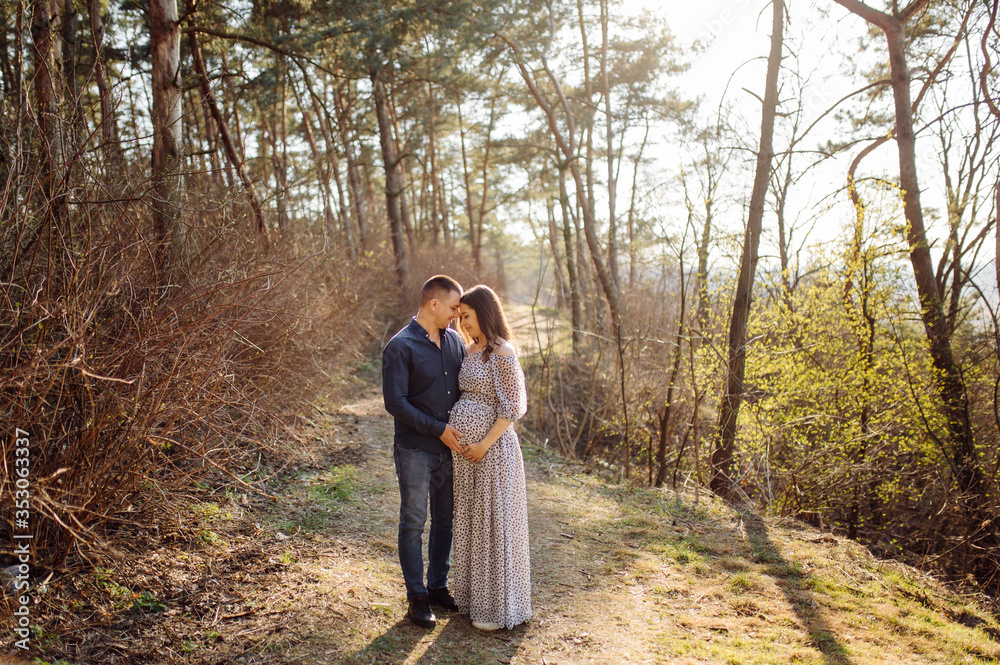 Happy pregnant couple in nature Happy pregnant couple in nature