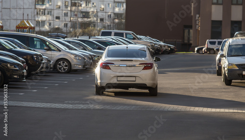 Cars parked in the courtyard of a residential building. © Yuri Bizgaimer