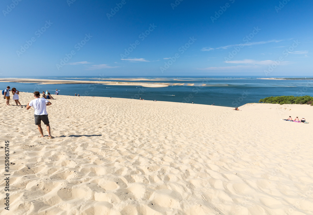 People on the Dune of Pilat, the tallest sand dune in Europe. La Teste-de-Buch, Arcachon Bay, Aquitaine, France People on the Dune of Pilat, the tallest sand dune in Europe. La Teste-de-Buch, Arcachon Bay, Aquitaine, France