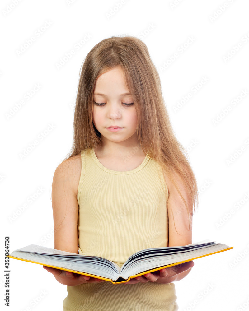 Young cute girl with long light brown hair reading the yellow book isolated on white background Young cute girl with long light brown hair reading the yellow book isolated on white background