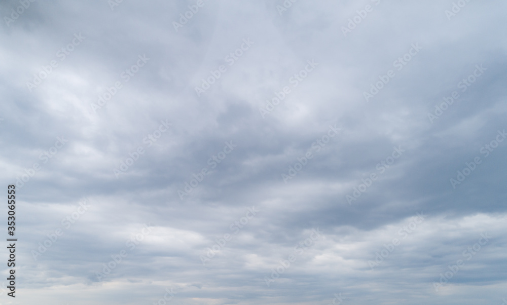 Cloudy gray sky with thick dense clouds. - obrazy, fototapety, plakaty 