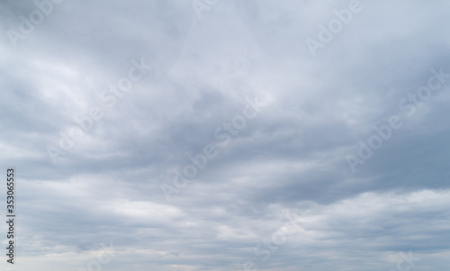 Cloudy gray sky with thick dense clouds. photo
