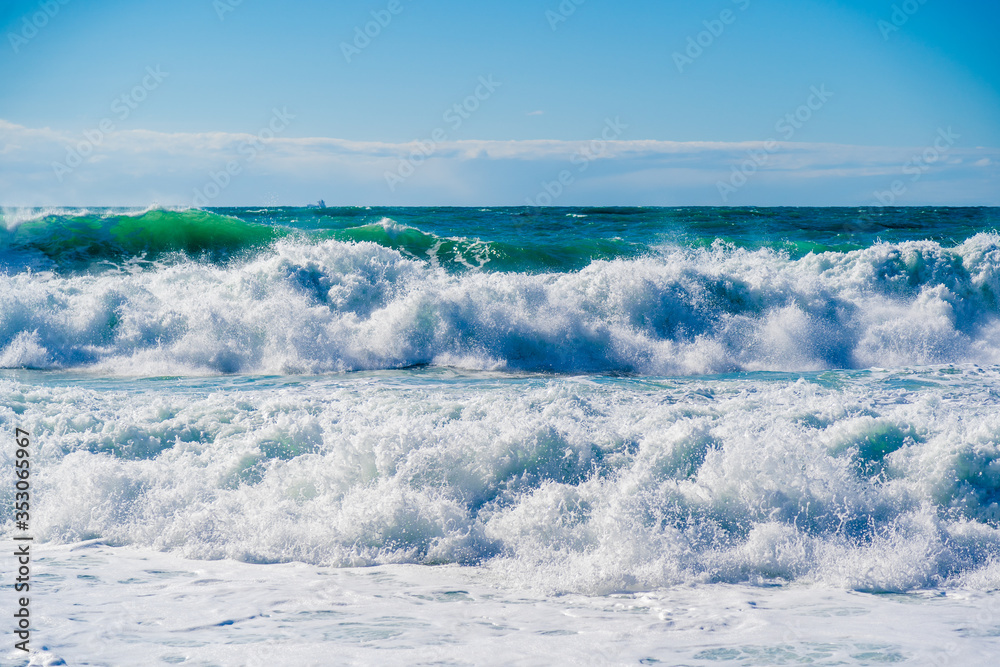 Beautiful storm waves in white foam in the Black sea. A sea of interesting emerald hue. Beautiful storm waves in white foam in the Black sea. A sea of interesting emerald hue.