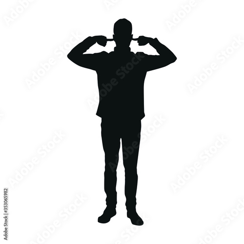 Silhouette of man covering both ears with hands