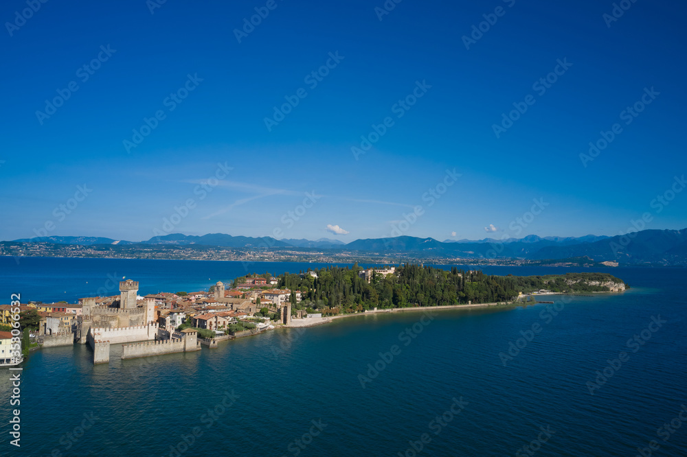 Panoramic aerial view of the Sirmione peninsula, Lake Garda Italy. Rocca Scaligera Castle. The village where Catullo lived.