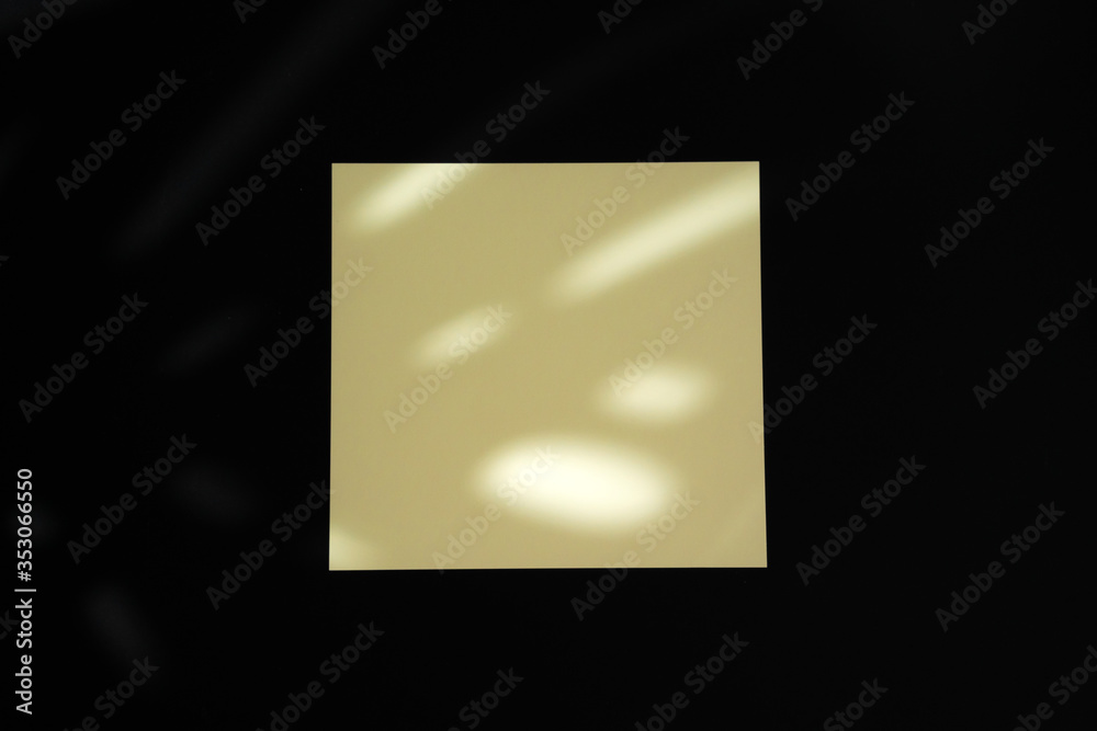 Single businesscard with copy space on black background. Photo with shadow Single businesscard with copy space on black background. Photo with shadow