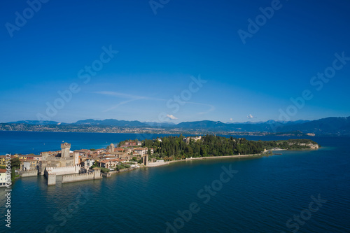 Panoramic aerial view of the Sirmione peninsula  Lake Garda Italy. Rocca Scaligera Castle. The village where Catullo lived.