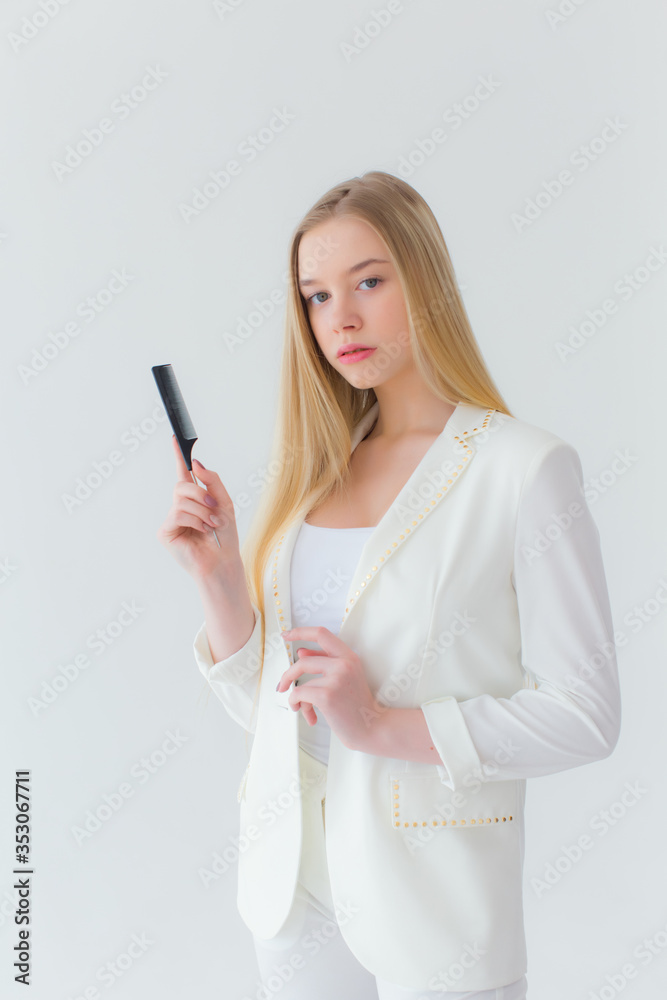 Stock Photo - Hair style, hairdresser and people concept - stylish girl with curling iron on white background. Stock Photo - Hair style, hairdresser and people concept - stylish girl with curling iron on white background.
