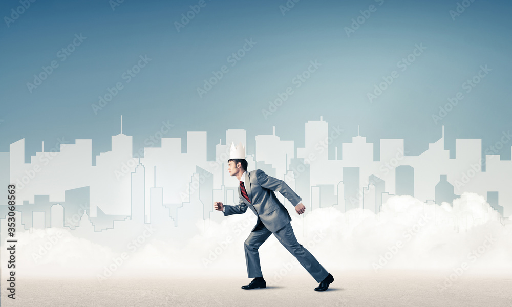 King businessman in elegant suit running and blue cityscape silhouette at background King businessman in elegant suit running and blue cityscape silhouette at background