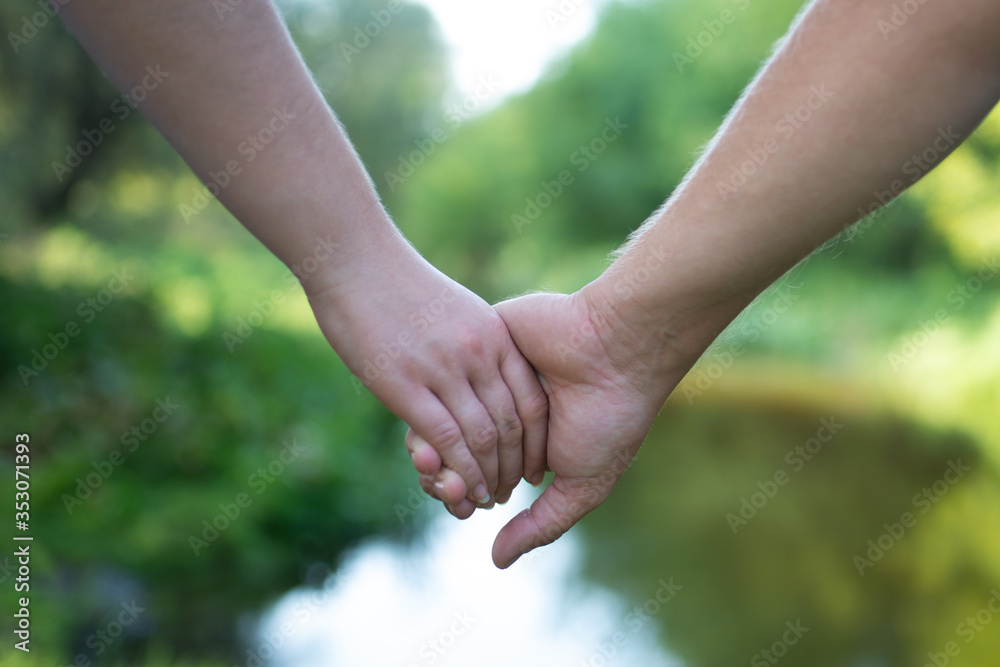 The hands of a couple in love