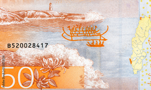 A bay view with waters and a lighthouse. Portrait from Swedish 50 Kronor 2015 Banknotes. An Old paper banknote, vintage retro. Famous ancient Banknotes. Collection. photo