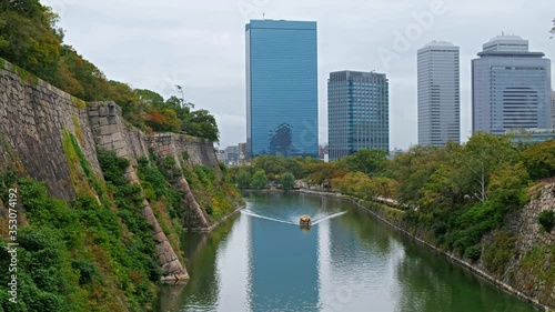 Inner moat of Osaka Castle with the Osaka Business Park on the background. Osaka. Japan photo