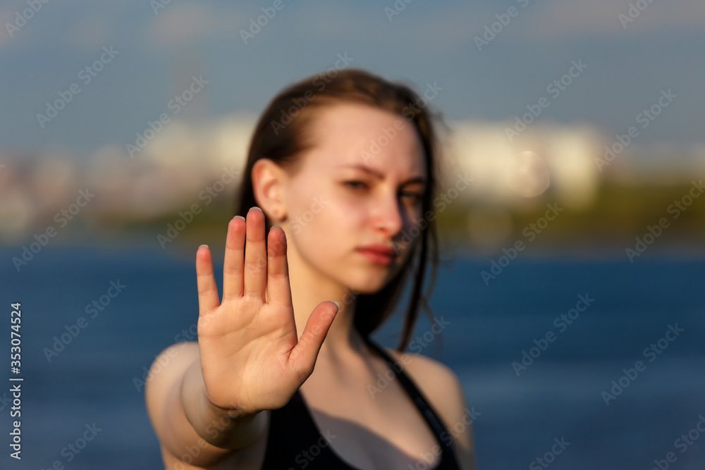 Girl teenager's palm is put forward closeup with blurred summer background Girl teenager's palm is put forward closeup with blurred summer background