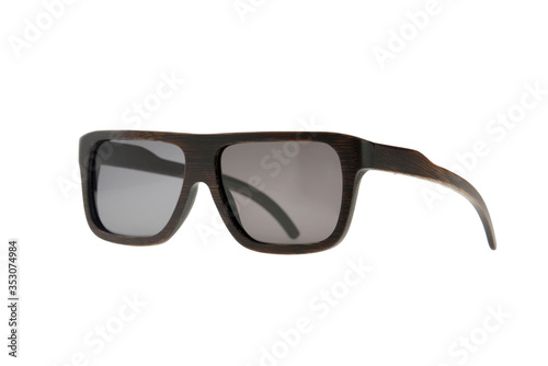 Wooden brown sunglasses and gray glasses on white background
