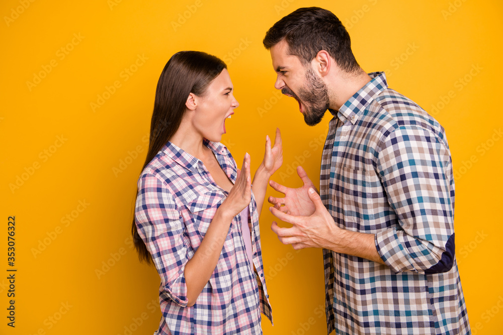 Profile photo furious lady guy couple girlfriend boyfriend yell each other scandal can't stay home together longer wear casual plaid shirts jeans isolated yellow color background Profile photo furious lady guy couple girlfriend boyfriend yell each other scandal can't stay home together longer wear casual plaid shirts jeans isolated yellow color background