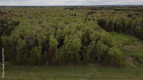 Aerial: Country landscape from a bird's eye view. 
New Moscow area near Kamenka village, Russia.
Color graded.