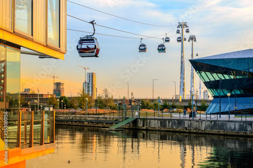 Emirates air line cable car at Royal Victoria Dock in London at sunset