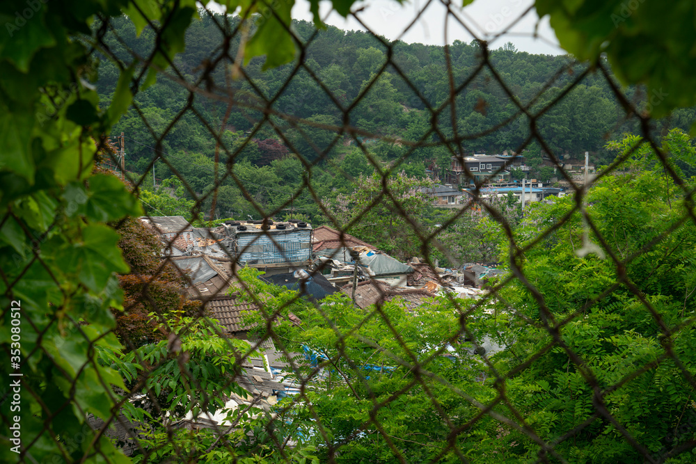 Seoul's last shanty town. Known as Village 104 it is only half filled with residents who live among empty neighbors waiting for demolition. Seoul's last shanty town. Known as Village 104 it is only half filled with residents who live among empty neighbors waiting for demolition.