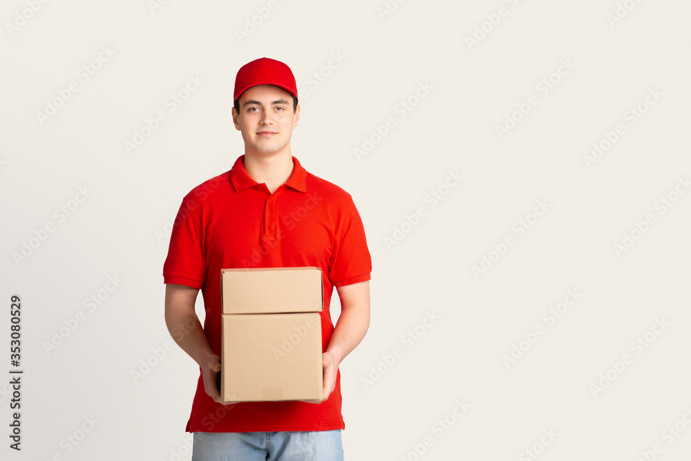 Parcel shipping and home delivery. Courier holds boxes Parcel shipping and home delivery. Courier holds boxes