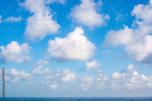 blue sky with clouds background © bmaldophotos