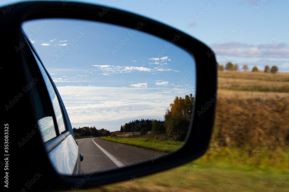 road and car mirror
