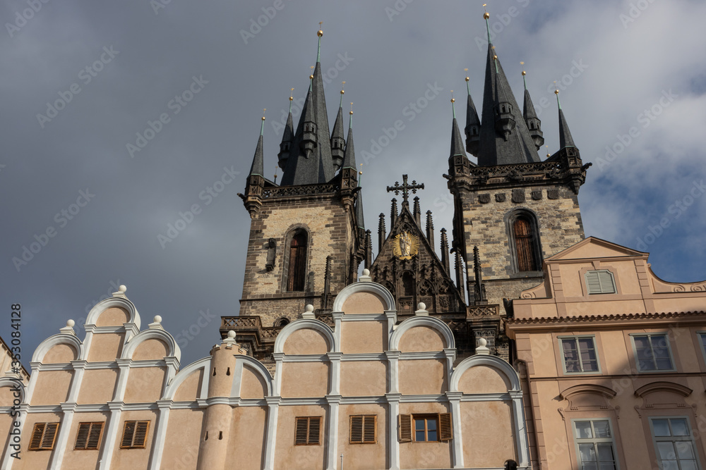 Tyn Cathedral in Prague with beautiful facades in the foreground at the famous old town square