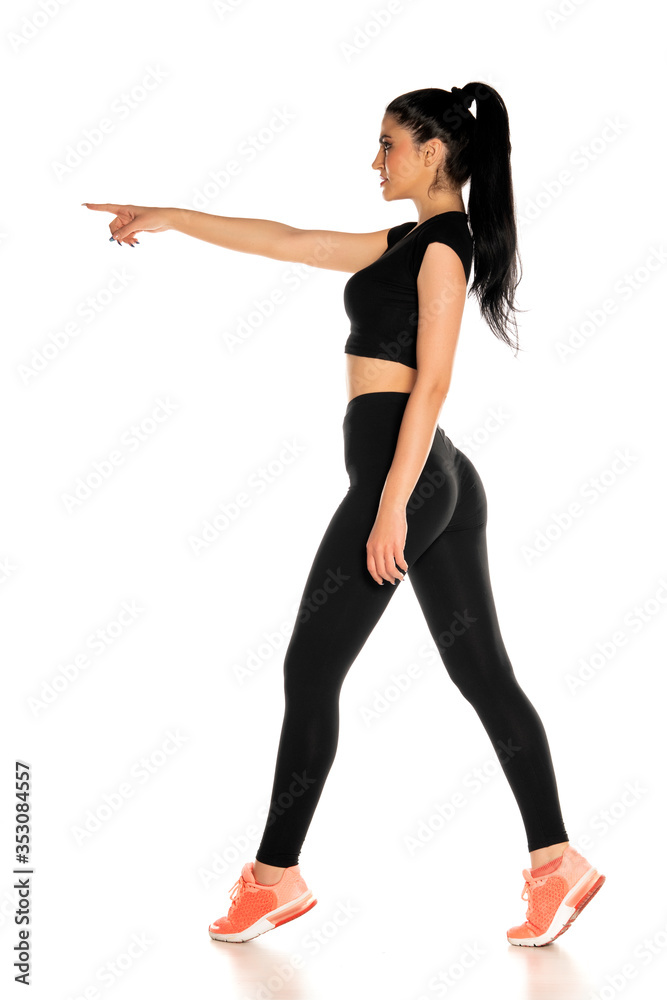 beautiful young sporty woman pointing on white beautiful young sporty woman pointing on white