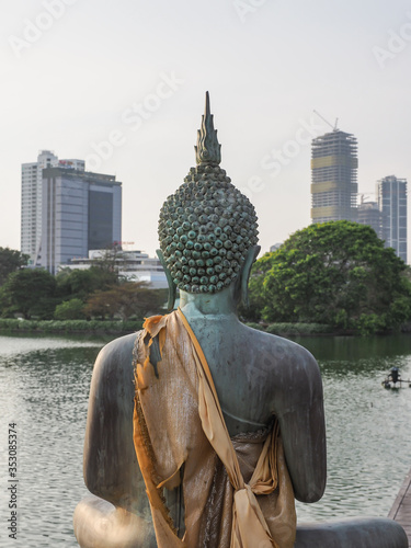 Buddha statues in Seema Malaka temple in Colombo, Sri Lanka, situated in the Beira Lake. photo