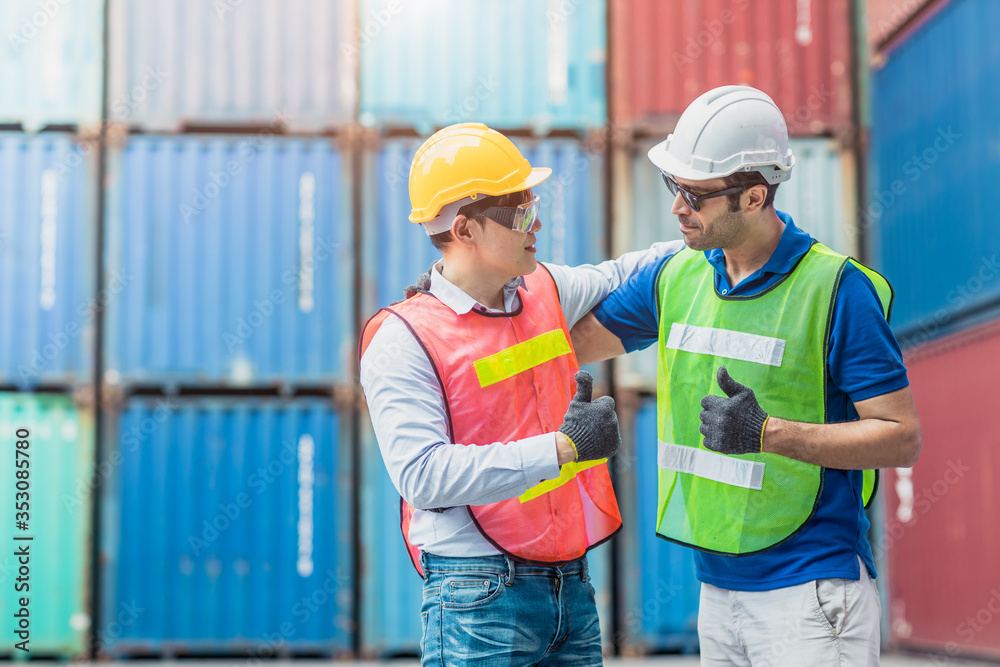 Teamwork of worker working good thumbs up together Happy smiling in Logistic segment container loading area cargo port. Teamwork of worker working good thumbs up together Happy smiling in Logistic segment container loading area cargo port.