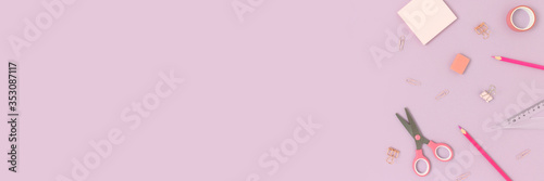 Top view of various stationery on a purple pastel background. Back to school concept banner with place for text.