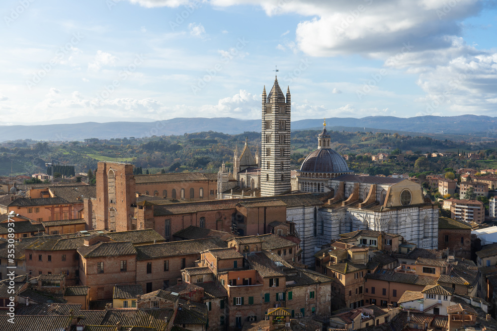 View of the Duomo and the city of Siena from the top of the tower of Mangia, Tuscany, Italy