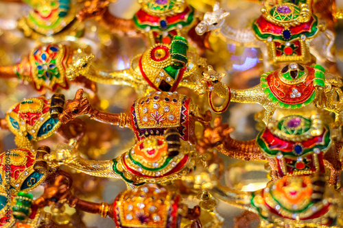 Display of gold decorative ornamental camels for sale at the souq market in Dubai © carlene