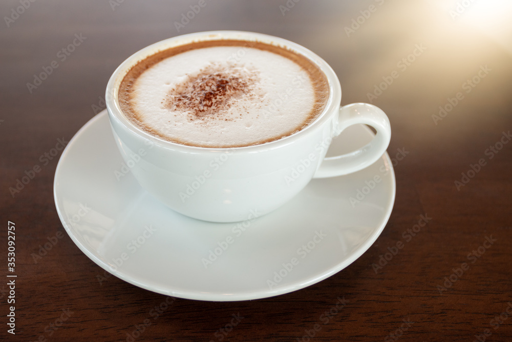 Coffee cup of cappuccino on wooden table in cafe Coffee cup of cappuccino on wooden table in cafe