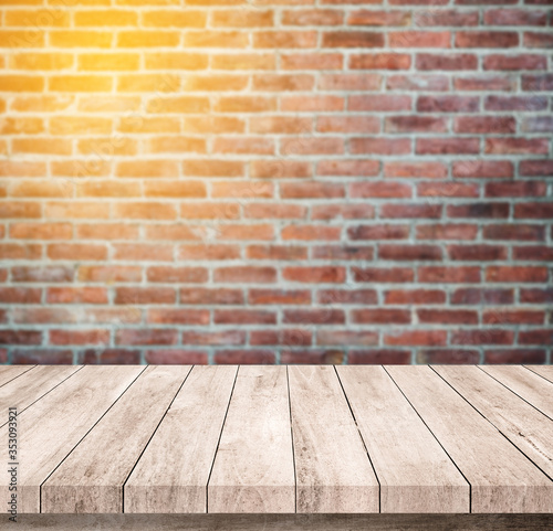 Old wood table with abstract old brick wall background for product display