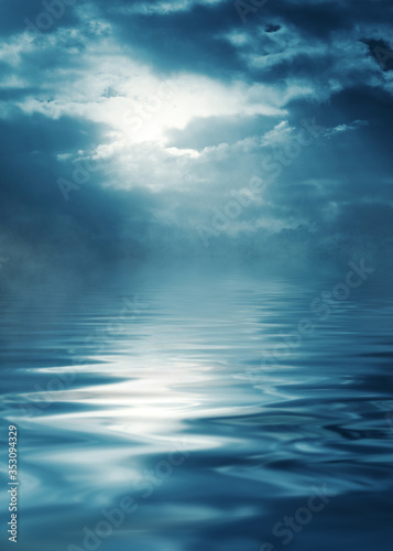 Reflection of the full moon on the water. Dark dramatic background. Moonlight, smoke and fog