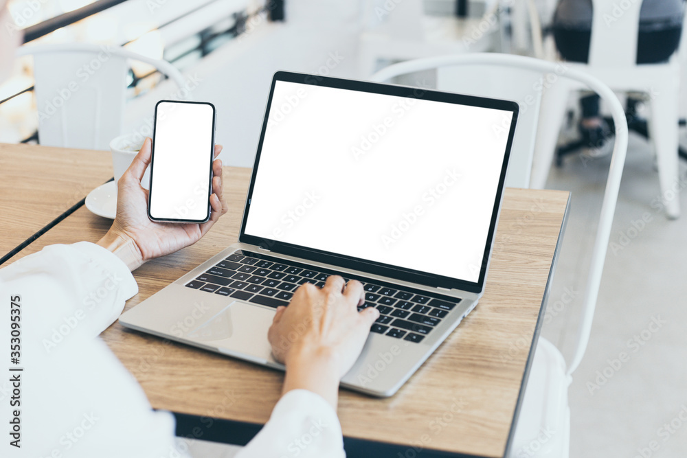 computer,cell phone mockup image blank screen with white background for advertising,hand woman work using laptop texting mobile contact business search information on desk in cafe.marketing,design computer,cell phone mockup image blank screen with white background for advertising,hand woman work using laptop texting mobile contact business search information on desk in cafe.marketing,design