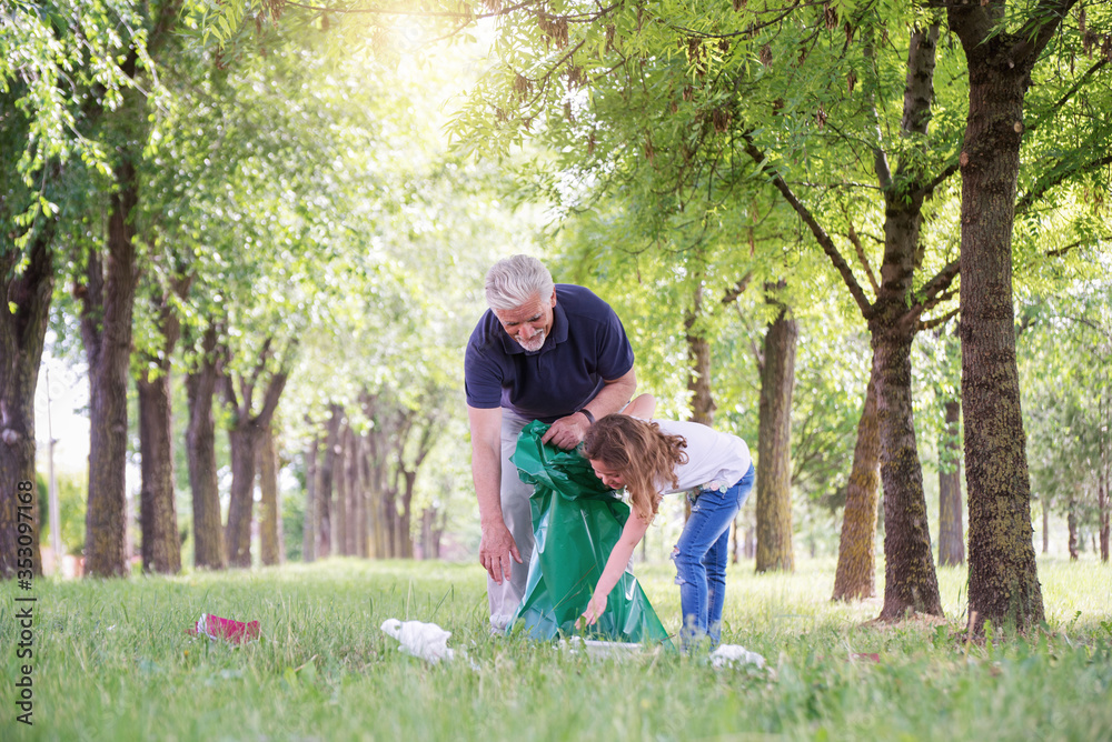 Fototapeta premium Grandfather and grandson Local clean park