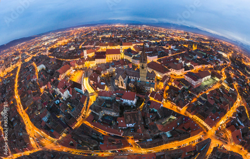 Wide panorama of Sibiu city, city center of Sibiu at evening twilight time photo