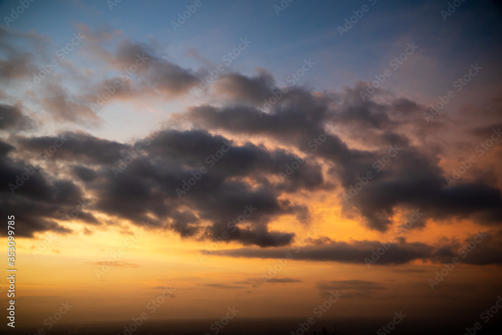 Colorful dawn / dusk sky with dark clouds