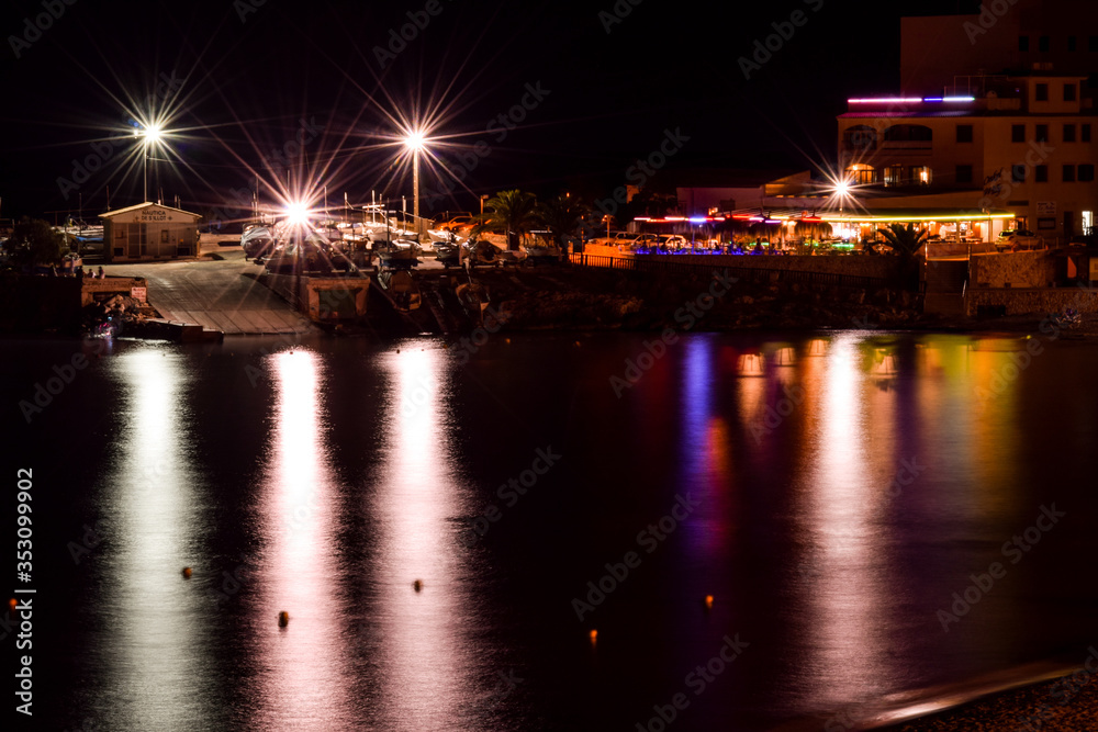restaurants in night in the harbour in Spain.