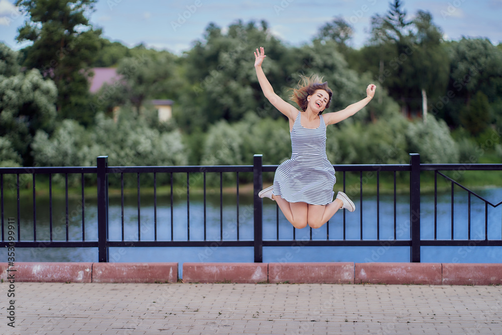 A happy woman is jumping for joy. Emotions