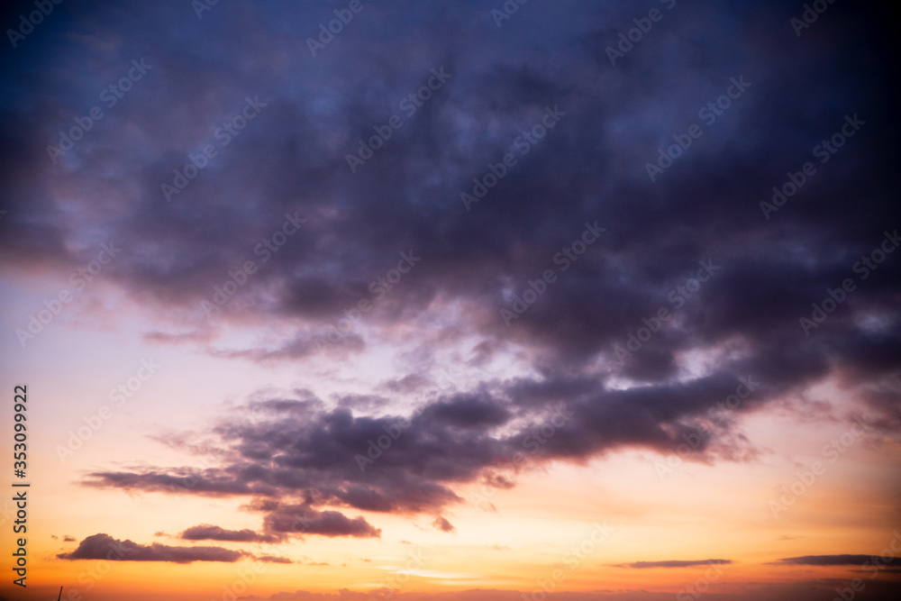 Colorful dawn / dusk sky with dark clouds