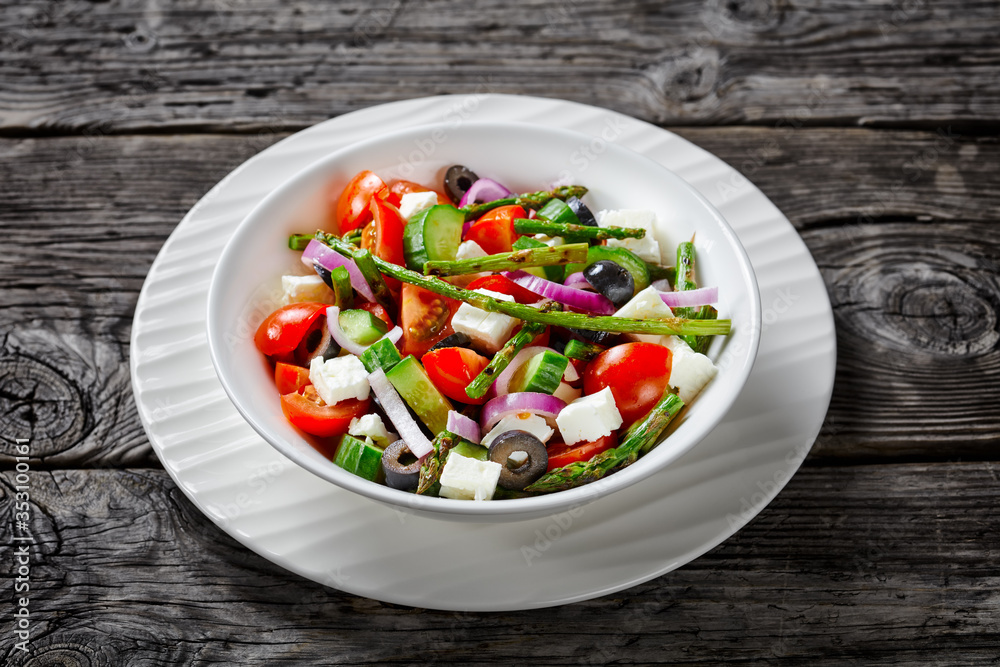Mediterranean salad with asparagus on a plate