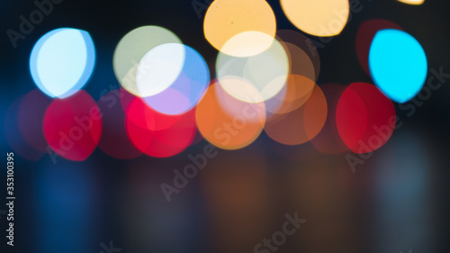 Night traffic light bokeh on road