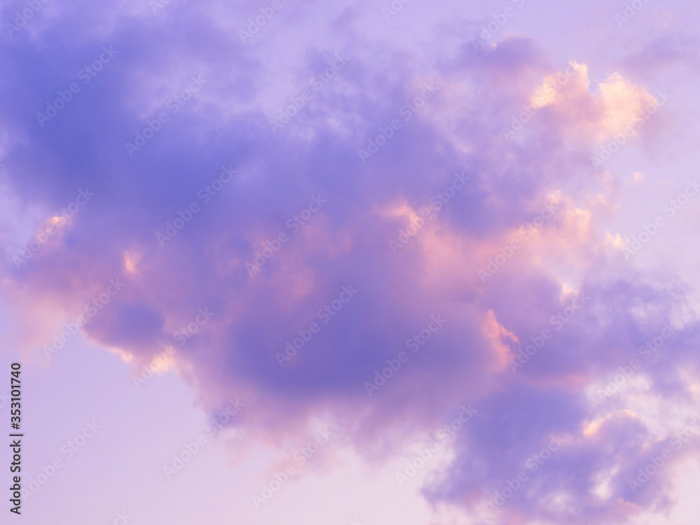 Purple puffy and fluffy clouds in the sunset sky.