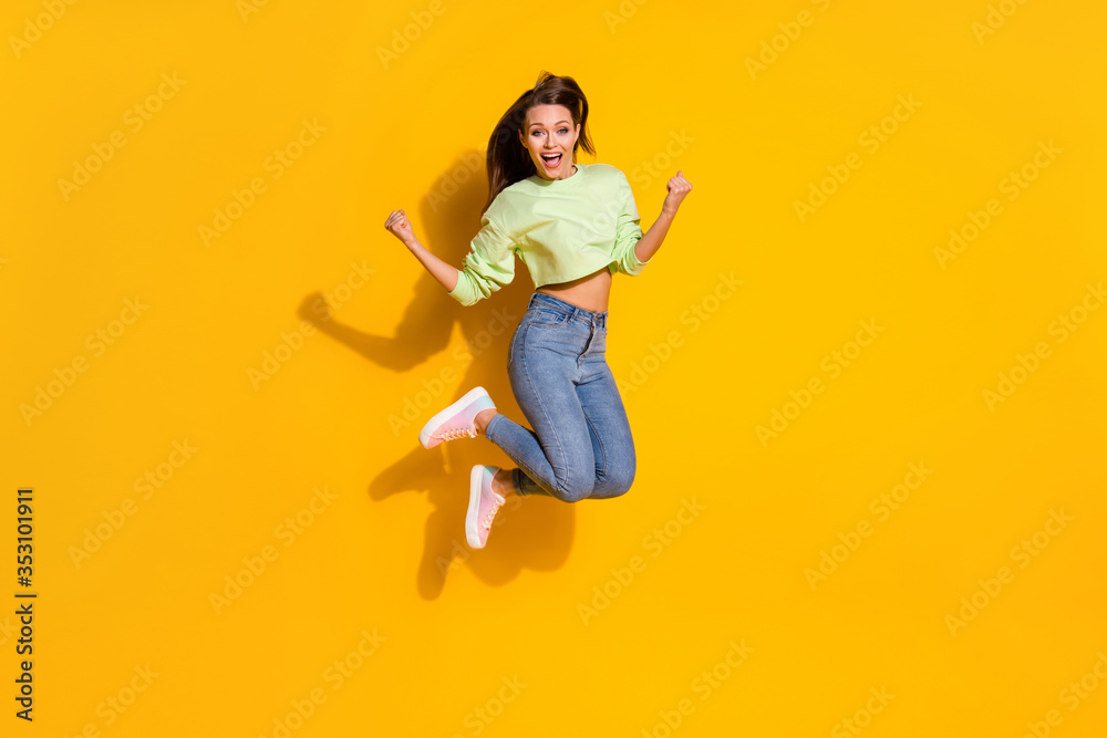 Full size photo of energetic ecstatic girl enjoy lottery discount win jump raise fists scream wear good look outfit isolated over shine color background Full size photo of energetic ecstatic girl enjoy lottery discount win jump raise fists scream wear good look outfit isolated over shine color background