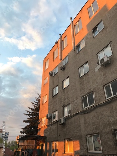 windows old soviet building at sunset