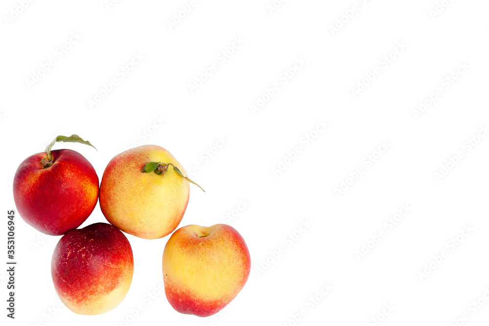 four ripe yellow and red nectarines with green leaves isolated on a white background four ripe yellow and red nectarines with green leaves isolated on a white background